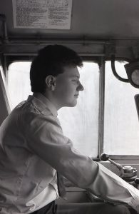 Black and white photo of Driver Lee Davies in charge of his locomotive