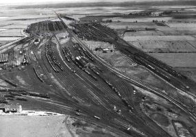 A 1951 aerial view of Whitemoor Yard showing the engine shed (far left), to its right the Down Reception Sidings and then Norwood Yard (with Trans-shipment Shed in the middle). Beyond these is the Down Yard and its outlet to Twenty Feet River. The Joint Line runs through the yard and to its right are the three parts of the Up Yard - the Reception Sidings (accessed from Twenty Feet River), the Main Yard and the Departure Sidings nearest the camera. Photo: Richard Munns