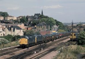 37106+37140 are pictured heading 6M47, the 10.45 Lackenby to Corby BSC through Barrow Hill in September 1983.