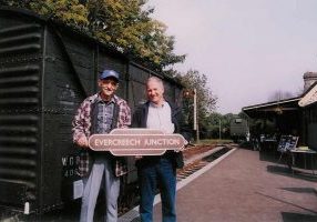 In September 2003, ex S&D Firemen Ian Bunnett (left) and John Swayer (right) are seen at Midsomer Norton station holding an original Evercreech Junction BR Totem that, at its time of sale, broke the record at £12,000. Photo: John Baxter.