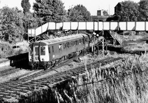 On August 31st 1971, Class 122 Gloucester RCW single car  unit W55012 departs from Priestfield with a Birmingham Snow Hill to Wolverhampton Low Level service. In the foreground the abandoned tracks of the Oxford, Worcester and Wolverhampton line towards Dudley can be seen. Photo: Michael Smyth.