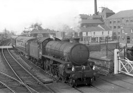Ex-LNER Thompson Class B1 pulls out of Grimsby Town station and over Garden Street Crossing on the final stage of its run to Cleethorpes. Photo: Dick Crane