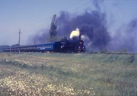 With blue sky above and yellow sunflowers in the foreground – inspiration for the Ukrainian flag – 0-10-0 Er 788-75 performs a run past in 1991, on one of the first tours run for foreign railway enthusiasts, in what was then still the Ukrainian SSR. Image credit: Jeremy Harrison
