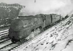 Streamlined Stanier LMS 'Princess Coronation' Class 4-6-2 No. 6243 'City of Lancaster' (with unstreamlined tender) works a northbound express from Euston during March 1947, approaching Northchurch Tunnel.