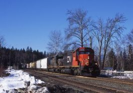 CN5374/6034 With an American eastbound manifest at Birch Island BC on 18 Feb 2005. Image Credit: John Day.