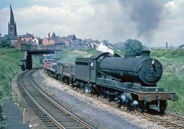Class 04/8 2-8-0 63897 departs Chesterfield Central working an up freight service in June 1962. KP Collection