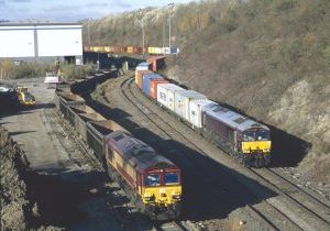 In 2021 traffic returned to the east end of Tinsley Yard. 66103 on a spoil train from Ripple Lane that has just been unloaded onto the new pad and 66743 approaching the new container terminal with a train from Felixstowe on 19th November.
Image Credit Phil Lockwood
