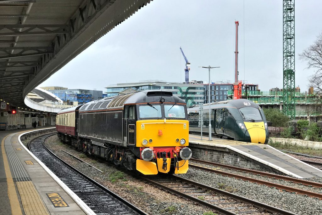 On 27th March 2024, Locomotive Services' 57311 is pictured at Bristol Temple Meads stabled with empty stock, class 47 D1924 (47810) being out of sight at the other end of the train.  The pair had worked an excursion from Bristol to Canterbury and return the previous day, and the train would depart as empty stock that afternoon for Eastleigh.  To the right of the picture, 802109 waits time at platform 15 with the 08.30 Paddington to Weston-super-Mare.  Image credit: Stewart Jolly