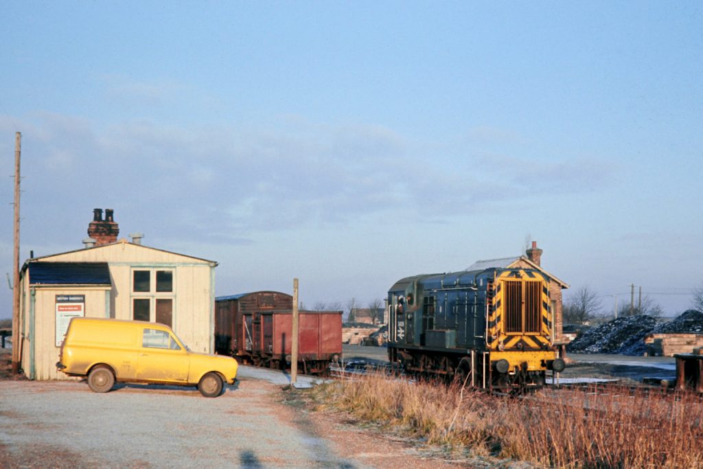 19701231-RAMSEY-NORTH-3409-08339-After-Arrival-with-08 The makeshift station buildings at Ramsey North changed little over the years, but unfortunately the unique goods shed with its double awnings (one on either side), that used to stand next to the brick building behind 3409, had been demolished by the time of this view on December 31st 1970. Having arrived on 9B08 from Holme, 3409 runs round its train to collect empties and position the arriving wagons. Coal and agricultural products were the mainstay of traffic on the branch. Photo: John Tolson, courtesy Trevor Davis.