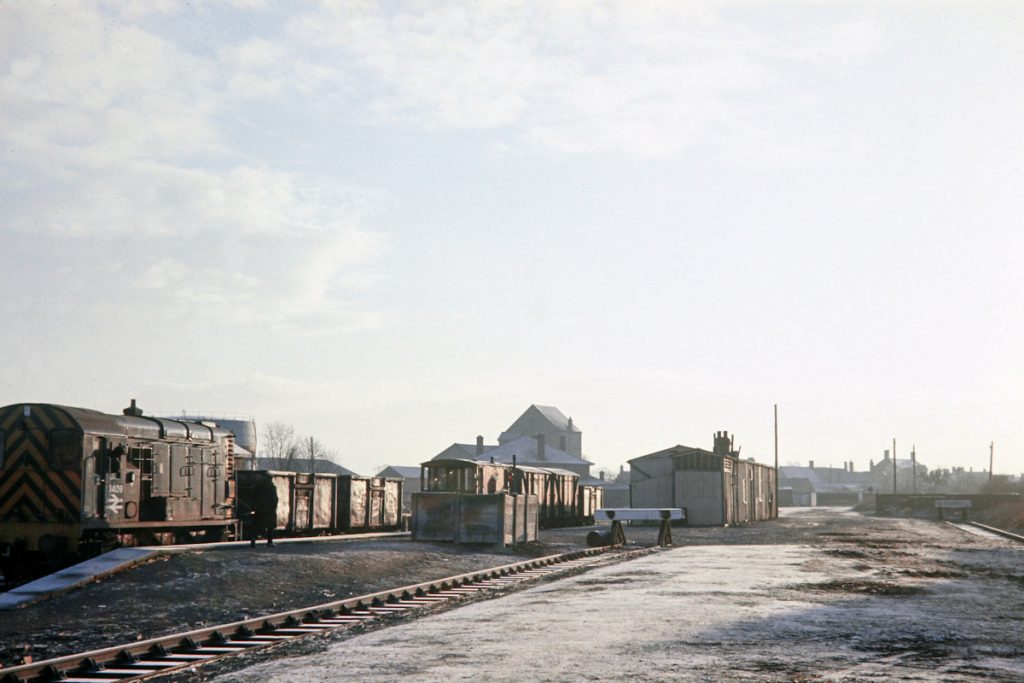 19701231-RAMSEY-NORTH-3409-08339-Shunting-08 A cold and frosty December 31st 1970 at Ramsey North sees BR Class 08 No. 3409 collecting two empty 16-ton mineral wagons and propelling them onto the guard's van (whose lamp catches the sun wonderfully!) at the rear of 9B08, the 08.35 departure from Holme. The two vans and single mineral wagon will then be positioned in the sidings and 3409 with its two empties and brake will return to Holme as 9B24, departing Ramsey at 09.35. The timetable allowed 35 minutes for the circa six mile journey along the branch which allowed for three level crossings and a 15 mph speed limit. Photo: John Tolson, courtesy Trevor Davis.