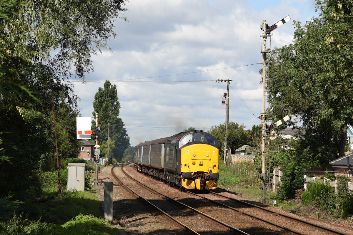 Cantley possessed one of the last double-arm repeater signals on the network, seen here in full working order as 37405 and 37424 storm past with the 12.18 (SO) Norwich to Yarmouth on 25th August 2018. Photo: Alan Jones
