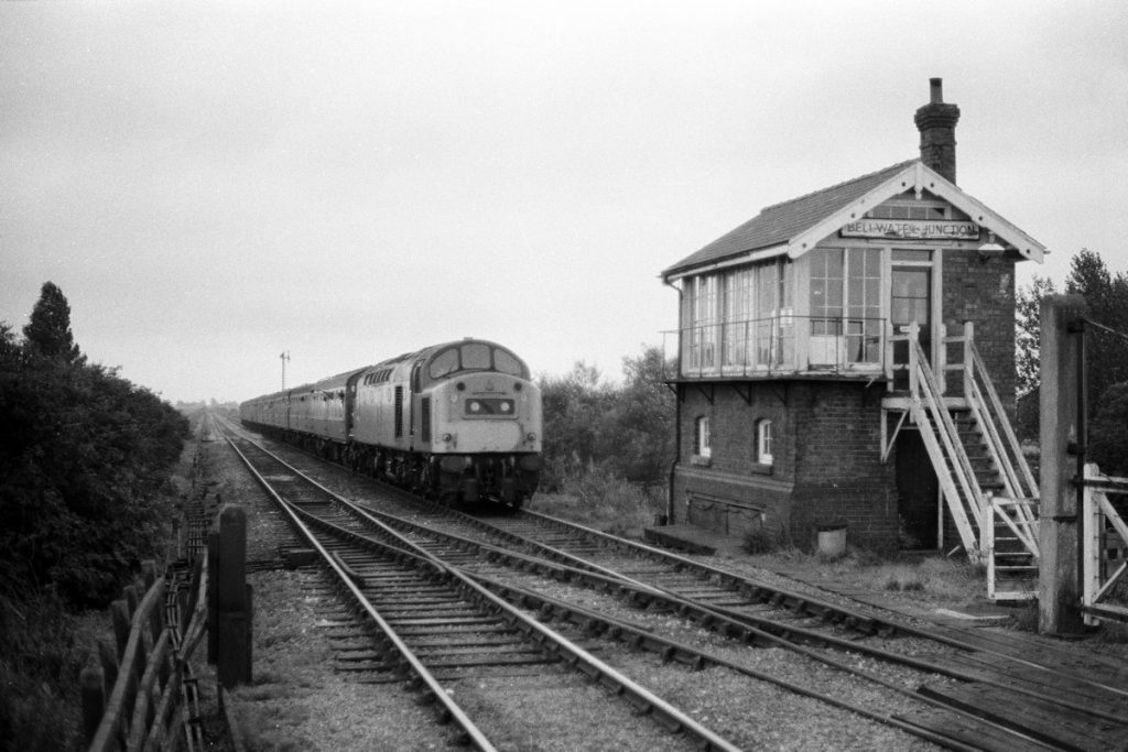 19840915-BELLWATER-Jc-40181-08-15-SO-Manchester-Skegness-Last-Class-40-to-Skegness-Alan-Jones-E4BW Although of poor quality, this photograph is included because of its historical significance. Taken in the most appalling weather on September 15th 1984, the last day of the season, it shows Class 40 No. 40181 heading the 08.15 (SO) Manchester Piccadilly to Skegness past Bellwater Junction - the working that brought to an end Class 40 traction to Skegness. In the following months, all Class 40s apart from those retained for the Crewe station re-modelling project were withdrawn, and this iconic locomotive class which played such an important part from the Pilot Scheme onwards, disappeared from the network. Photo: Alan Jones.
