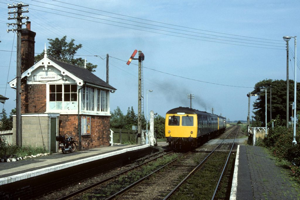 19840818-HAVENHOUSE-E51259-12-41-Nottingham-Skegness-Alan-Jones-E5W In the 1980s, Havenhouse was an operational museum of Great Northern Railway signalling and as such was a delightful place to spend a few hours on a sunny Summer's afternoon. The museum feel is complemented by the signalman's 1966 Honda 90cc motorcycle. Pre-dating this by eight years, 1958-built Class 105 Cravens set E51259 and E54434 brings up the rear of the 12.41 Nottingham to Skegness on August 18th, 1984. Photo: Alan Jones.