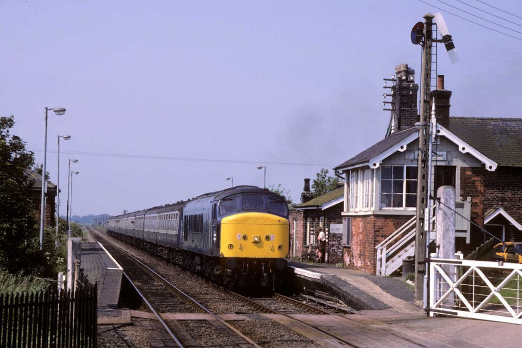 19870704-HAVENHOUSE-45150-1E07-07-07-SO-Sheffield-Skegness-2-Alan-Jones-EW For many years one of the first Summer Saturday trains of the day to reach Skegness was 1E07, the 07.07 from Sheffield via Nottingham. It was generally a Class 45 Peak, although occasionally it would produce a pair of Tinsley Class 20s. On a scorching hot July 4th 1987, 45150 had the honour and the driver applies a little throttle to regain speed after a signal check from the Havenhouse signalman. Photo: Alan Jones.