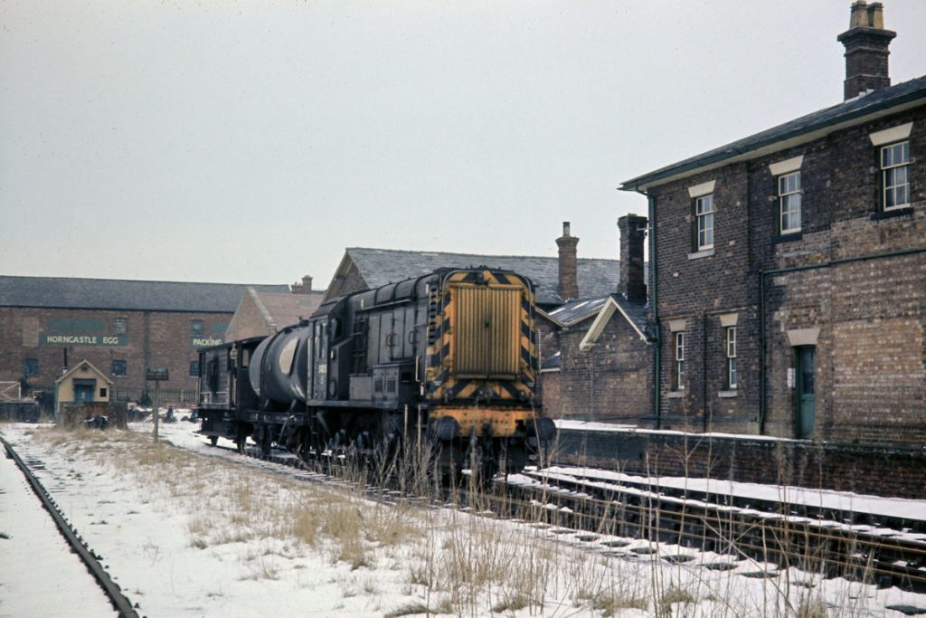 19700219-HORNCASTLE-D4075-Shunting-in-the-Yard-JMT34713-John-Tolson-E4W Having completed its shunting movements at Horncastle on February 19th 1970, Blackstone-engined BR Class 10 No. D4075 waits time before departing for Woodhall Junction and Lincoln Holmes Yard as 9K79 at 14.03. Passenger services to Horncastle were withdrawn on 13th September 1954 and good facilities closed on 5th April 1971, shortly after closure of the majority of the East Lincolnshire network as of Monday 5th October 1970. Photo: John Tolson, courtesy Trevor Davis.