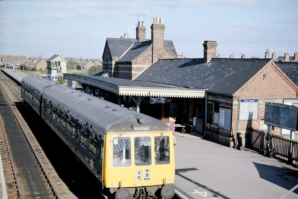 19701003-MABLETHORPE-11 The Branch train to Willoughby waits at Mablethorpe's Up platform on the last day of operations, Saturday October 3rd 1970. Mablethorpe signal box can be seen beyond the station building, of wooden construction with characteristic East Lincolnshire decorative bargeboards. Photo: John Tolson, courtesy Trevor Davis.