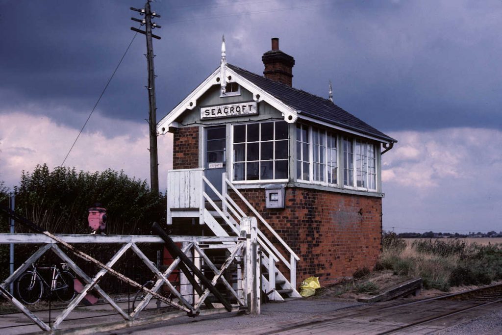 19830917-SEACROFT-Box-2-Alan-Jones-EW Seacroft station closed as early as 1953, and the remains of the platform ramp can be seen in this view taken thirty years later on September 17th 1983. The Signal Box remained in situ until the early 90s, when BR carried out a number of alterations to the signalling on the line, latterly to control the crossing of a minor road to a few farms. Photo: Alan Jones.