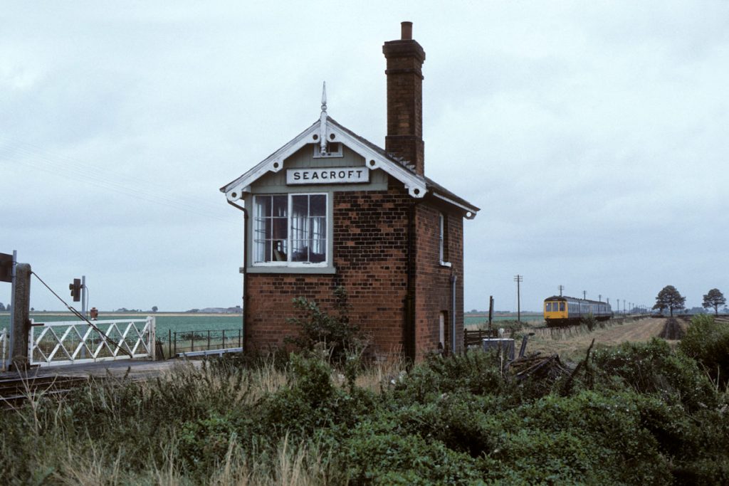 19890909-SEACROFT-10-46-Derby-Skegness-Alan-Jones-E4W A different perspective of Seacroft Box, on September 9th 1989, showing a five-car DMU formation on the 10.46 Derby to Skegness. By this time, the timetable was in transition with several of the long-established locomotive-hauled Summer Saturday trains having ceased and the service starting to move towards a year-round pattern that remained relatively stable over the whole year. Photo: Alan Jones.