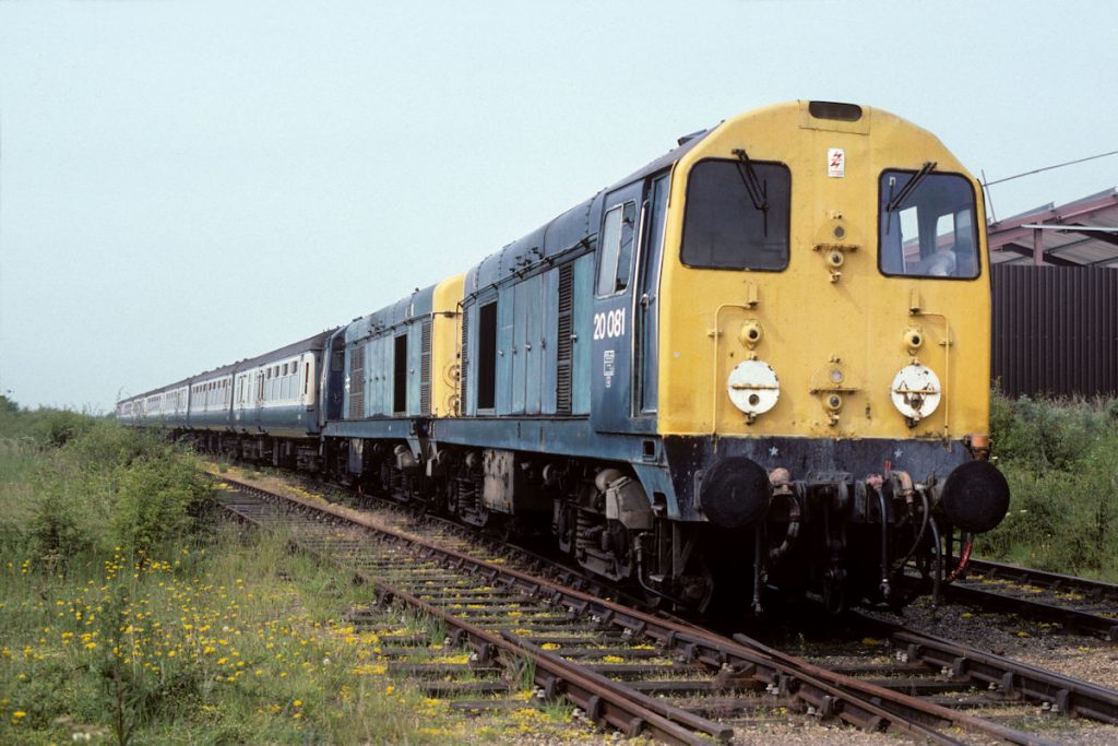 19910706-SKEGNESS-1-2008120016-Run-Round-06-30-ex-Sheffield-Alan-Jones-E5W A very pleasant surprise occurred at Skegness on Saturday July 6th 1991 with the arrival of 20081 and 20016 on the 06.30 from Sheffield via Nottingham. The pair is seen in the Carriage Sidings after propelling out. They are being uncoupled and will run round, couple-up and propel back into the station. A very tight 34 minutes were allowed for all of these manoeuvres, between arrival at and departure from the station. Photo: Alan Jones.