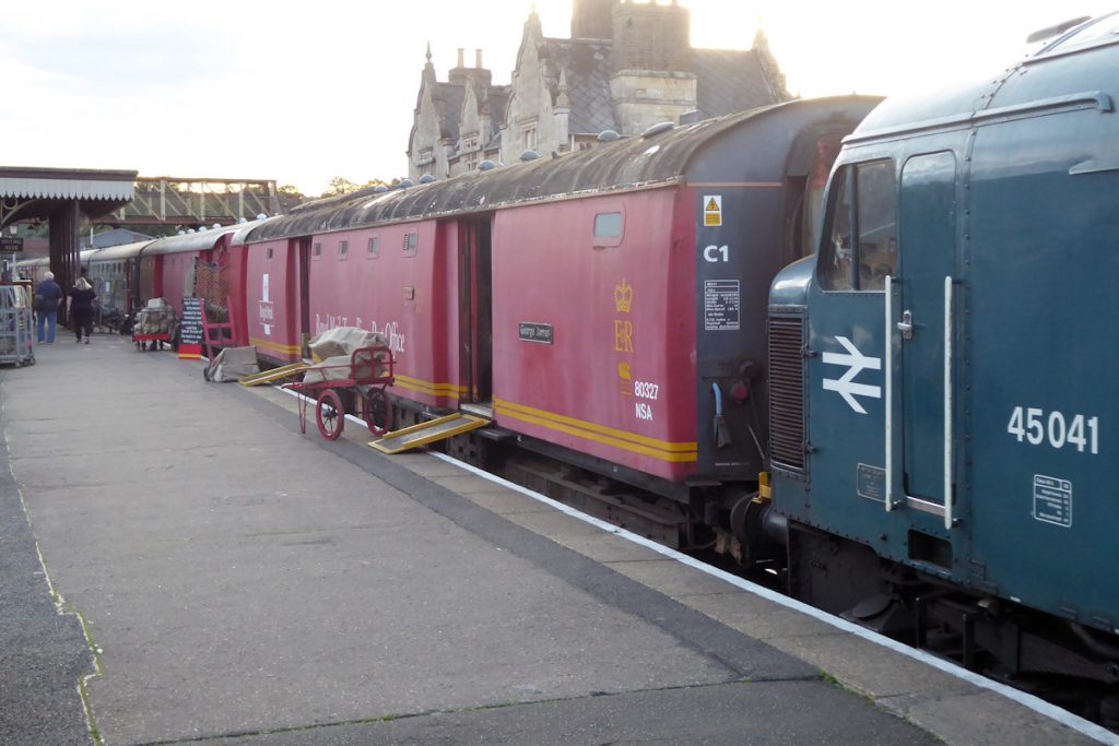 20240928-WANSFORD-45041-Royal-Tank-Regiment80327-George-James80337-Brian-White-19 The 'Night Mail' stands at the Nene Valley Railway's Wansford station on Saturday 28th September 2024 as passengers arrive and take their seats. The nearer vehicle, 80327, is a Diagram 728 vehicle and was fitted for arms only (no nets). The farther vehicle, 80337, is a Diagram 729 vehicle and had provision for arms and nets (although it was not fitted with them when in operation). The difference between these two diagrams can be seen in the roofline, where 80337 has a notch above the nearer door to accommodate the net. Photo: Alan Jones.