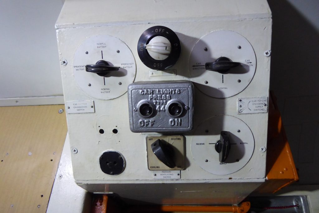 20240928-WANSFORD-80327-George-James-19 The carriage lighting control box of NSA vehicle 80327 on the Nene Valley Railway on 28th September 2024. The manual nature of the control is clearly seen, with good provision for emergencies through the routing of lighting supplies between adjacent carriages and the ability to switch between normal and emergency batteries. Photo: Alan Jones.