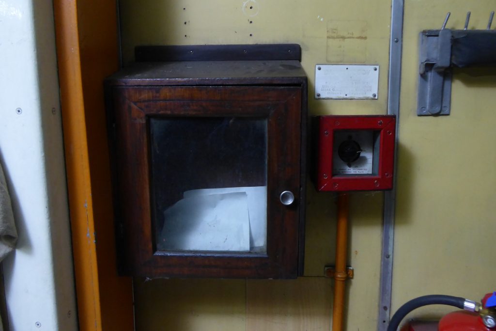20240928-WANSFORD-80327-George-James-19 A view of the letter box inside NSA vehicle 80327, with its glass-fronted door for ease of visibility. A late-posting fee was applied to letters posted in these boxes. Between the years 1880 and July 1969 the fee was a halfpenny, rising to one penny from July 1969 to February 1971. Upon decimalisation the fee became half of a new penny from February 1971 to June 1974 and finally one new penny from June 1974 to September 1976 when the late-posting fee was abolished. Photo: Alan Jones.