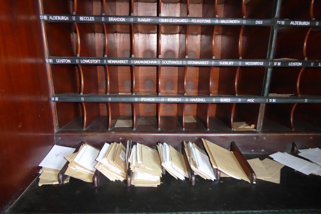 20240928-WANSFORD-80337-Brian-White-19 A close-up of a Short Letter frame in sorting carriage 80337. These boxes were sized to take envelopes of the same width but around half the length of the current 'DL' envelope. The letters in the foreground are separated by pull-out bars which gave additional storage capacity if needed by the sorting staff. 28th September 2024. Photo: Alan Jones.