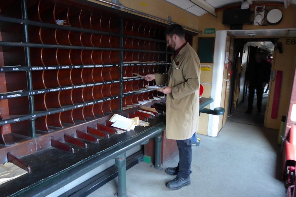 20240928-WANSFORD-80337-Brian-White-19 The Night Mail event on the Nene Valley Railway on September 28th 2024 included live demonstrations of sorting mail in TPO carriages. Here a member of the NVR's TPO Group demonstrates this in the Short Letter frame at No. 10 position in NSA vehicle 80337. TPO staff were required by the Post Office to be able to sort 30 letters per minute (i.e. one letter every 2 seconds). Photo: Alan Jones.