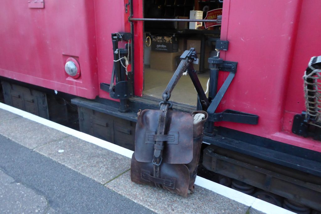 20240928-WANSFORD-80337-Brian-White-19 The traductor arms of 80337 are on display at Wansford station before departure of the 'Night Mail at 19.00. The robustness of the pouches can be seen in this view, especially the thickness of the connector that fixes the pouch onto the end of the arm. Given that the pouches were made entirely from leather, the high cost can be imagined. The string tied to the arms was used by the crew to lower the arms gently down when the train was in motion, in readiness for dropping off the pouches in the lineside nets. 28th September 2024. Photo: Alan Jones.