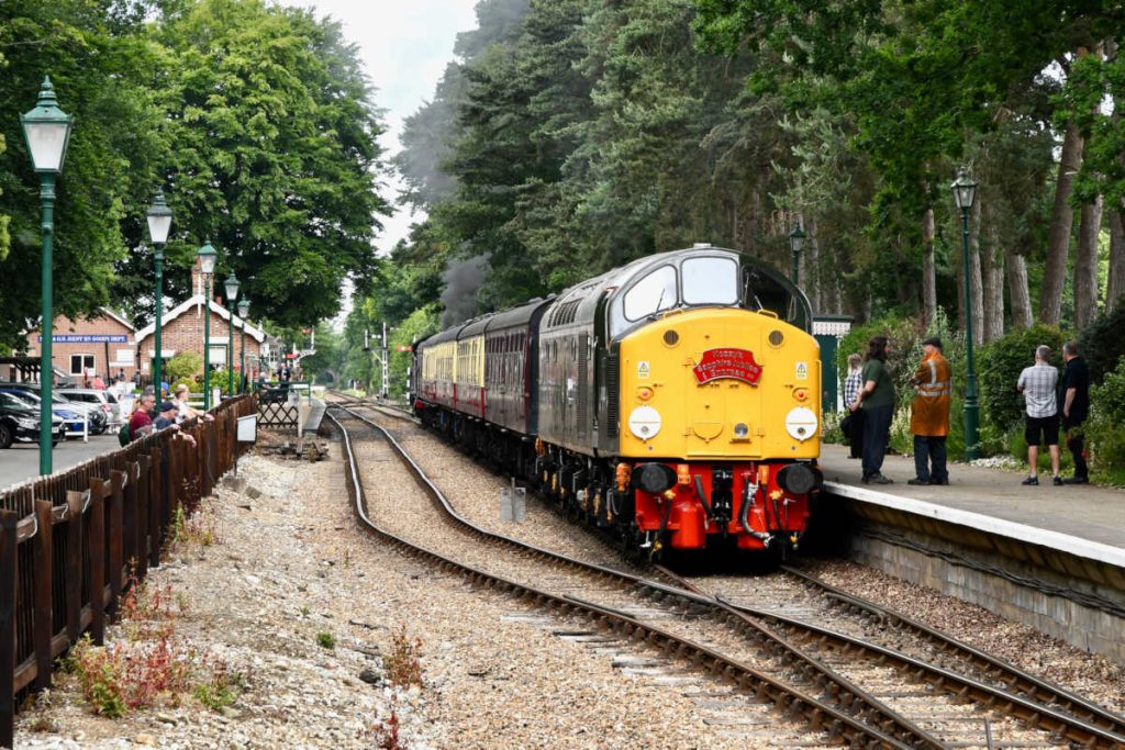 20250615-HOLT-D213-arrival-from-Sheringham-with-GWR-4277-on-rear-Diesel-Gala-Michael-Smyth-AW As far as is known, Class 40s never worked on the M&GN line, with its closure on February 28th 1959 (and the remaining section to Melton Constable on April 4th 1964) overlapping with the time that Class 40s were employed exclusively on Main Line duties. Notwithstanding, immaculately restored D213 'Andania' makes a magnificent sight and sound at Holt on Sunday 15th June 2025 during the North Norfolk Railway's 2025 Diesel Gala. Photo: Michael Smyth.
