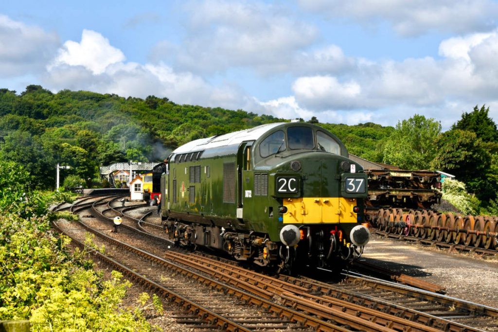 20250615-WEYBOURNE-D6732-Diesel-Gala-Michael-Smyth-EW Delivered new to Hull Dairycoates (50B) in March 1962, English Electric Type 3 (Class 37) No. D6732 (37032) is always a delight to behold on the North Norfolk Railway. In its customary immaculate condition, showing its livery on delivery with small yellow panels, D6732 comes off Weybourne shed on June 15th 2025 to commence its duties for the day as part of the North Norfolk Railway's 2025 Diesel Gale. Photo: Michael Smyth.