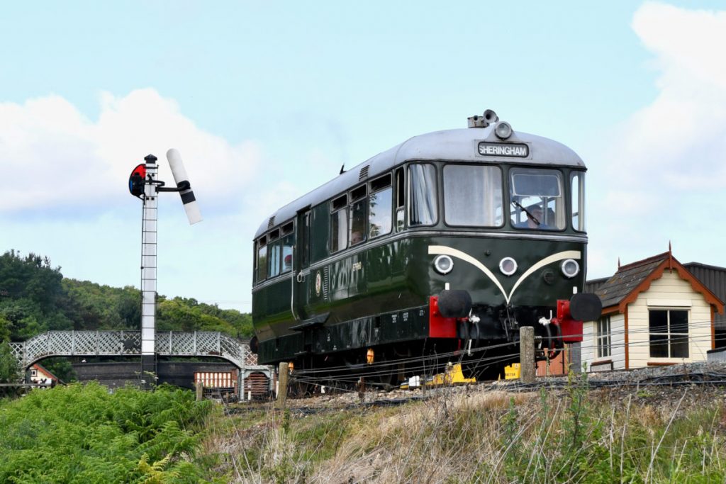 20250615-WEYBOURNE-E79960-Diesel-Gala-2-Michael-Smyth-AW The North Norfolk Railway has a wonderful selection of original and replica Great Northern Railway signalling and Weybourne provides an idyllic location for much of this. Heading towards Sheringham on Sunday 15th June 2025, Waggon und Maschinenbau four-wheel railbus No. E79960 passes the diminutive Down Starting signal as it pulls out of the station. Photo: Michael Smyth.