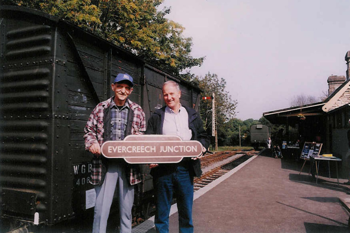 In September 2003, ex S&D Firemen Ian Bunnett (left) and John Swayer (right) are seen at Midsomer Norton station holding an original Evercreech Junction BR Totem that, at its time of sale, broke the record at £12,000. Photo: John Baxter.