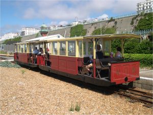 Unmistakably we are in Brighton, on the seafront, admiring The Volks Railway.