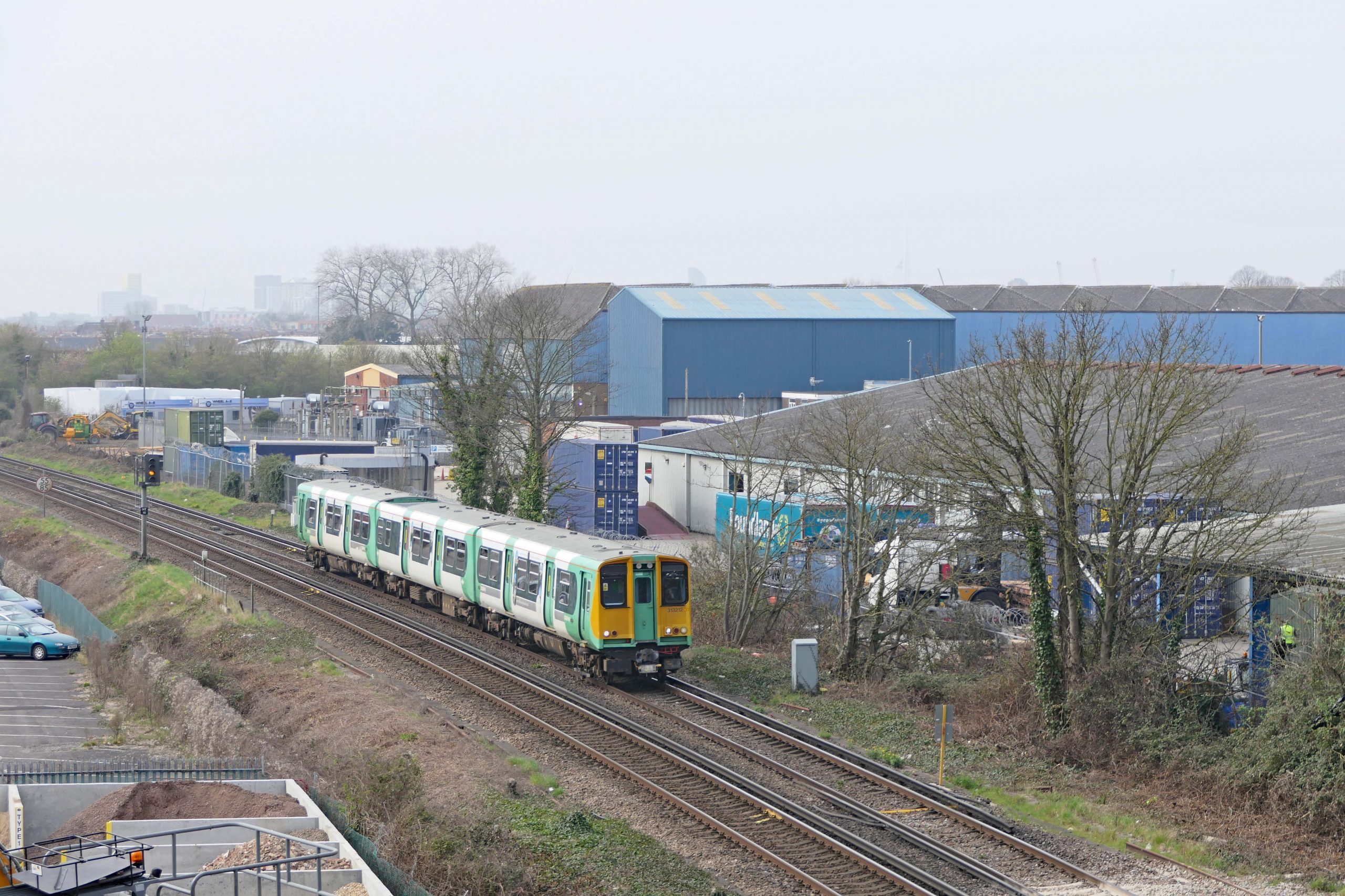 313 212 pulls away from Hilsea with the 10:57 Portsmouth & Southsea to Littlehampton. 28 March 2022.
