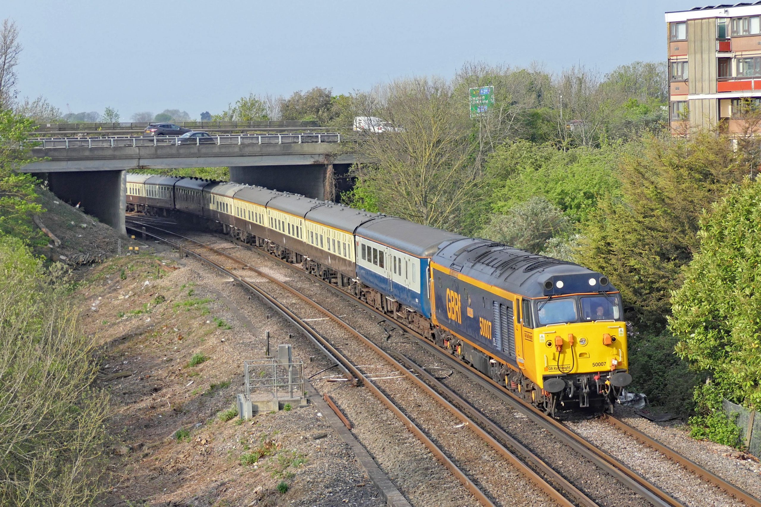 Passing over Portcreek Junction Class 50 007 heads the 08:11 Portsmouth & Southsea to Bognor Regis leg of 'The Great Britain' Saturday 23 April 2022.  Image Credit: Roger Sandford