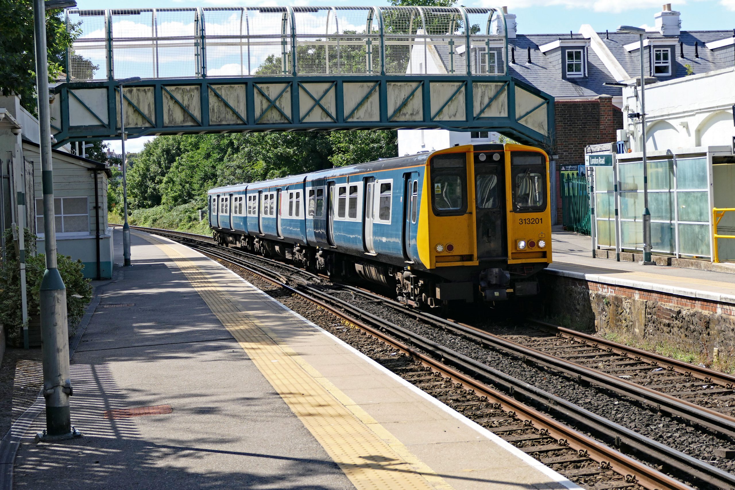 313 201 approaches London Road Brighton on the 14:41 Brighton to Seaford service. 05 August 2022.