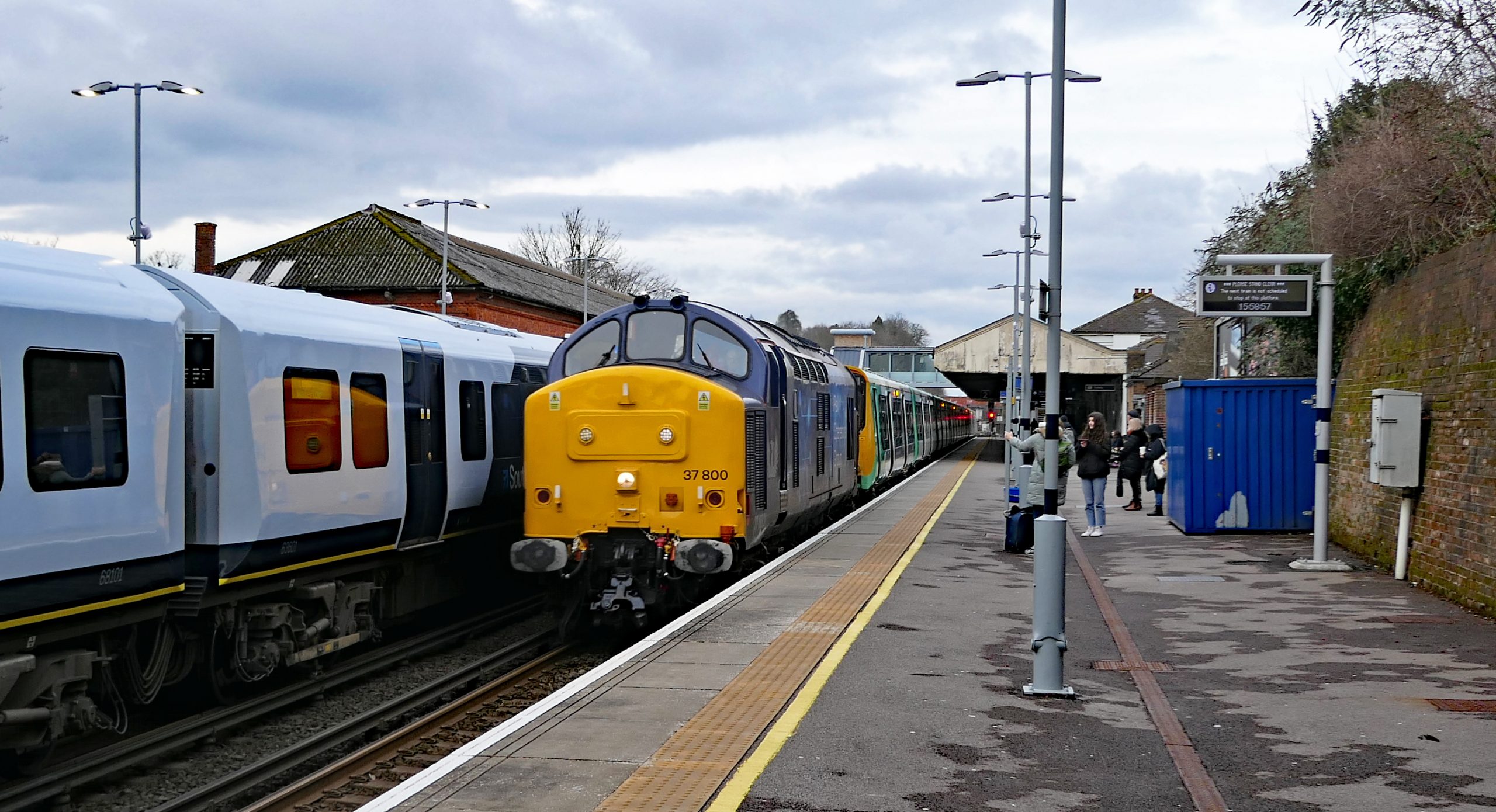 The first three Class 313s 202, 214 & 217 are taken to Eastleigh for storage, hauled by Class 37 800. Seen passing Winchester 106 minutes late with the 10:24 from Lover's Walk, Brighton to Eastleigh. Friday 10 March 2023.