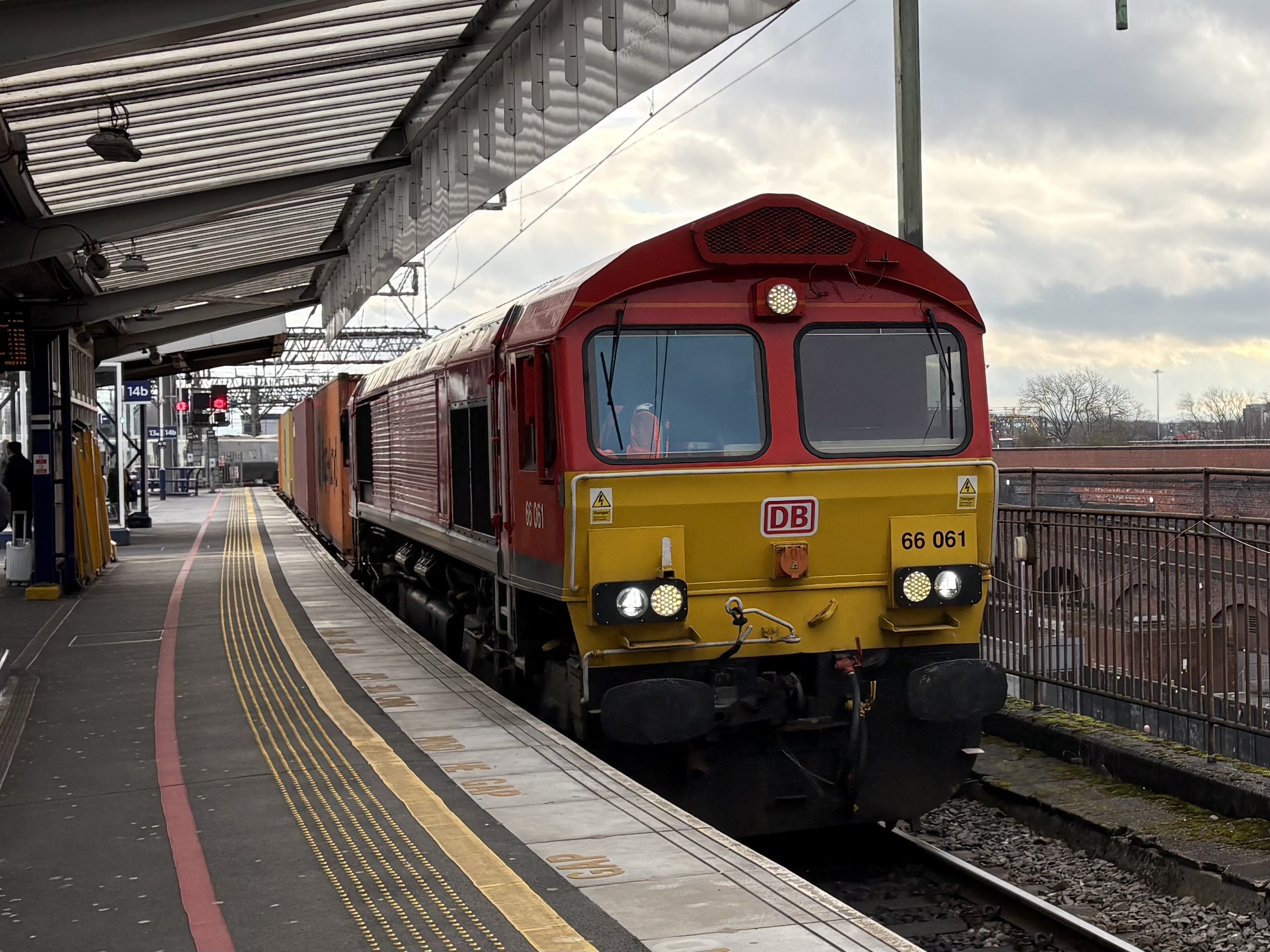 66061 passing one of the through platforms at Manchester Piccadilly with service 4M83 from London Gateway DB Cargo to Trafford Park Euro Terminal : Image credit - Peter Hughes