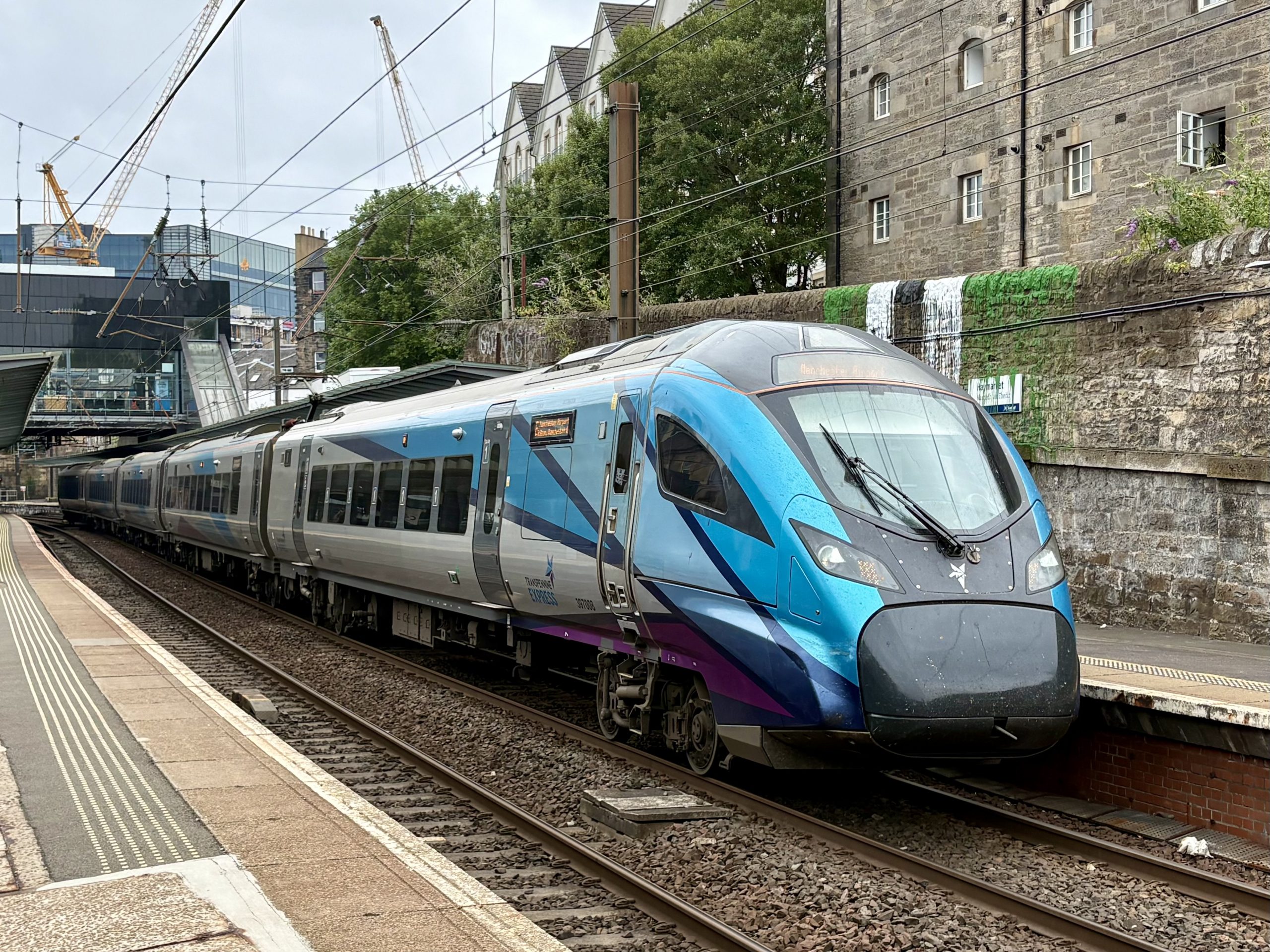 Civity Unit 397008 at Haymarket with the 1M87 service from Edinburgh Waverley to Manchester Airport : Image credit - Peter Hughes