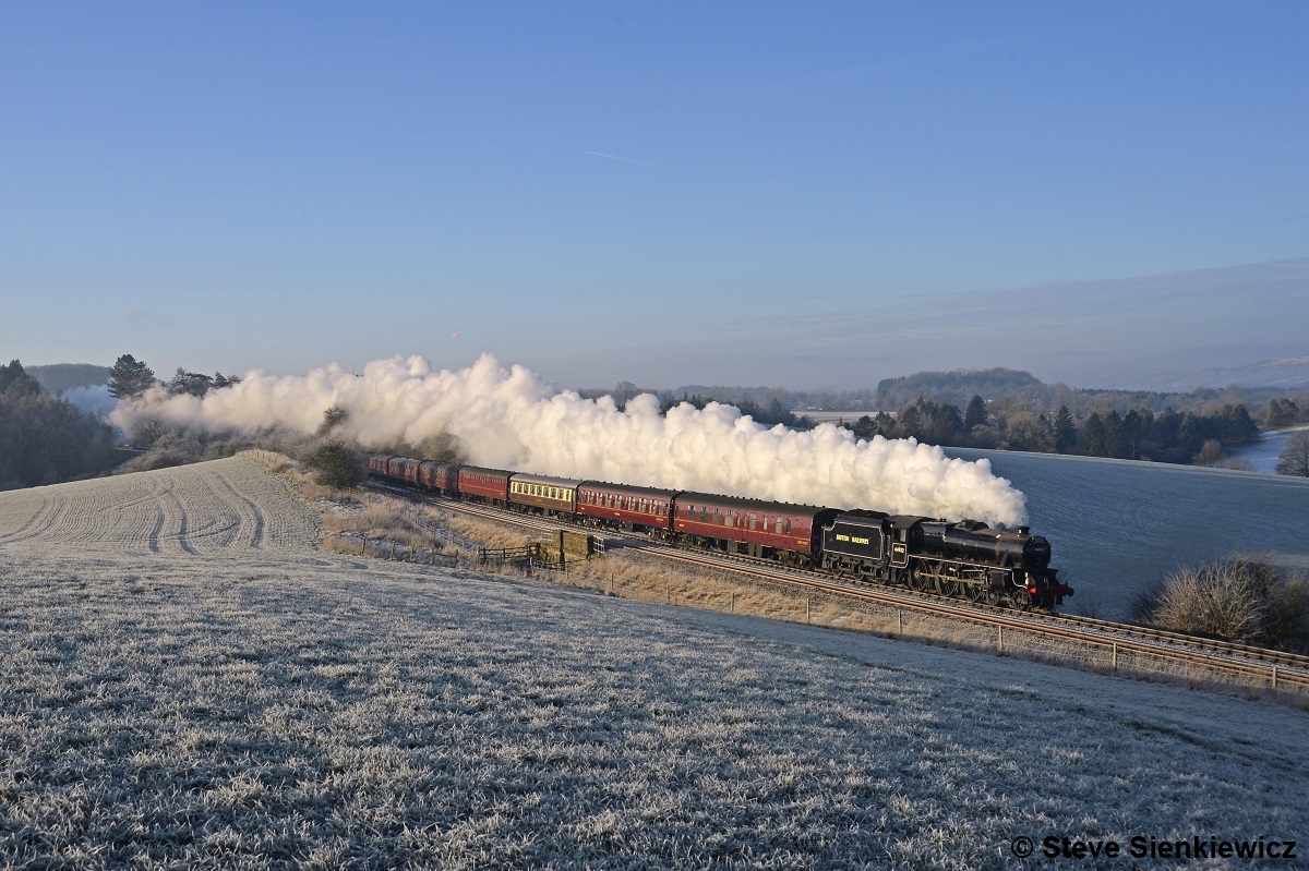 In sub-zero temperatures, Class 5 44932 heads away from Gisburn in fine style with 1Z30, the 07.34 Manchester Victoria - Carlisle 'The Winter Cumbrian Mountain Express' on 21st January 2023. Steve Sienkciewicz