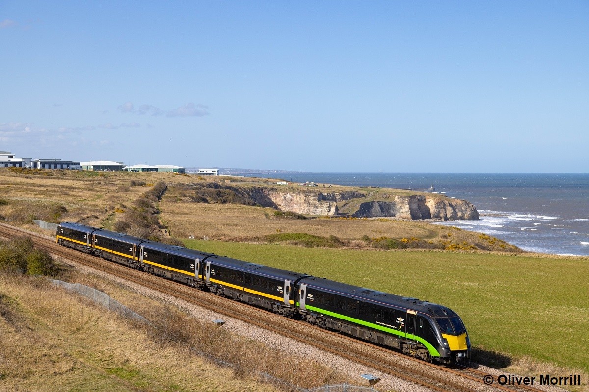 As the world's first dual fuel LNG-powered passenger train, Grand Central's 180112 'James Herriot' received a green stripe in place of the usual orange on one of its Driving cars. It's seen here passing Dawdon on the scenic Durham Coast Line. Oliver Morrill
