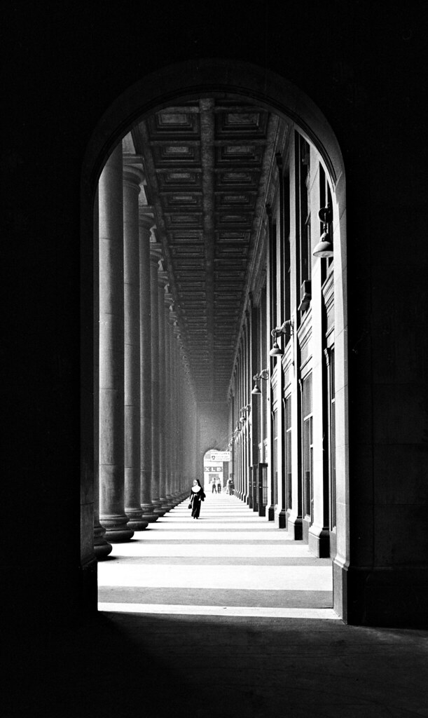 A nun walking through the massive columns outside its waiting room in 1964 gives Chicago Union Station a cathedral-like appearance in one of John E. Gruber’s most iconic photographs.
