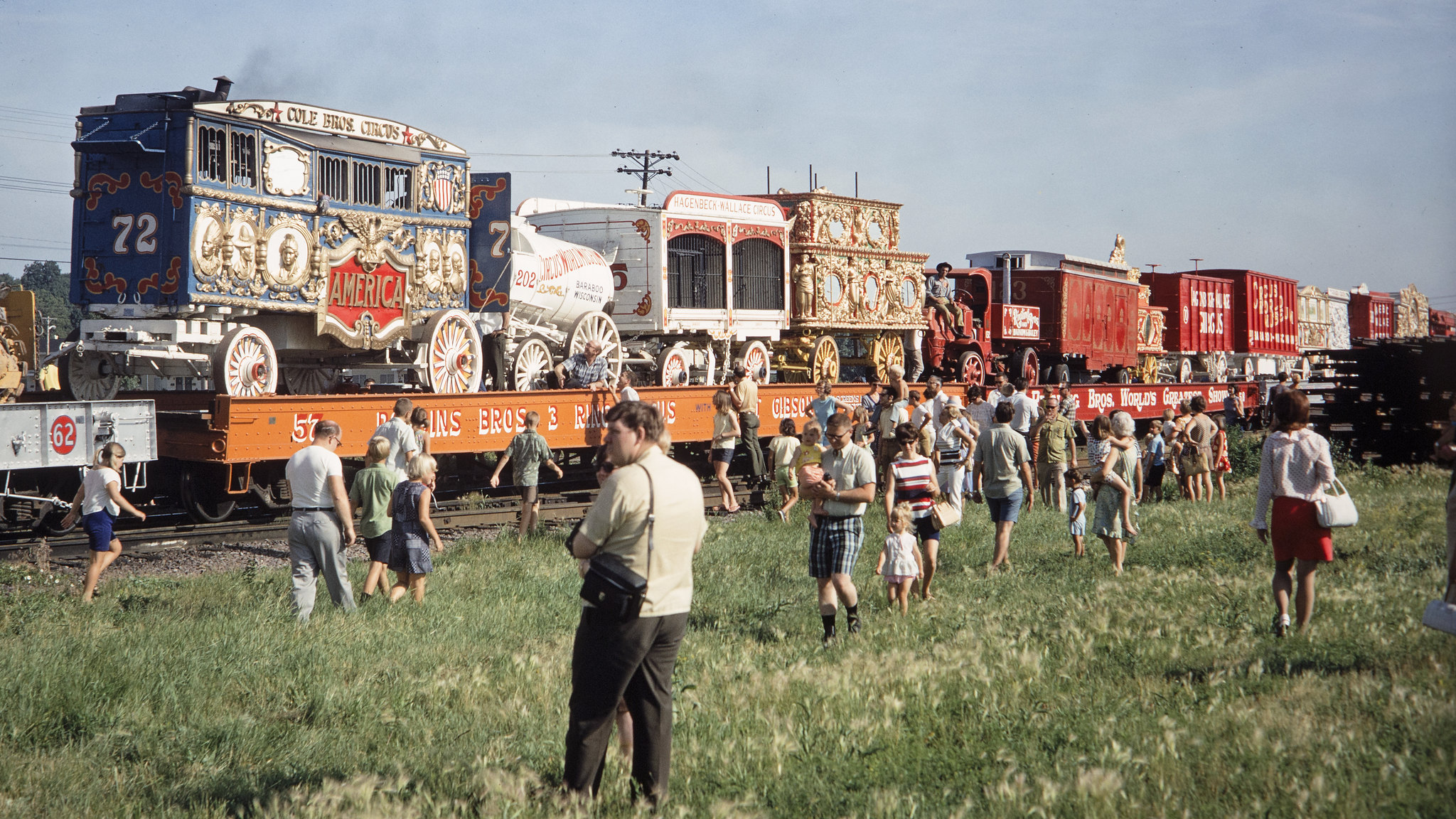 A crowd of people views the Milwaukee Circus Train from Circus World Museum during its stop at the Chicago and North Western Railway yard in Madison, Wisconsin on June 30, 1970. Photograph by Thomas F. McIlwraith